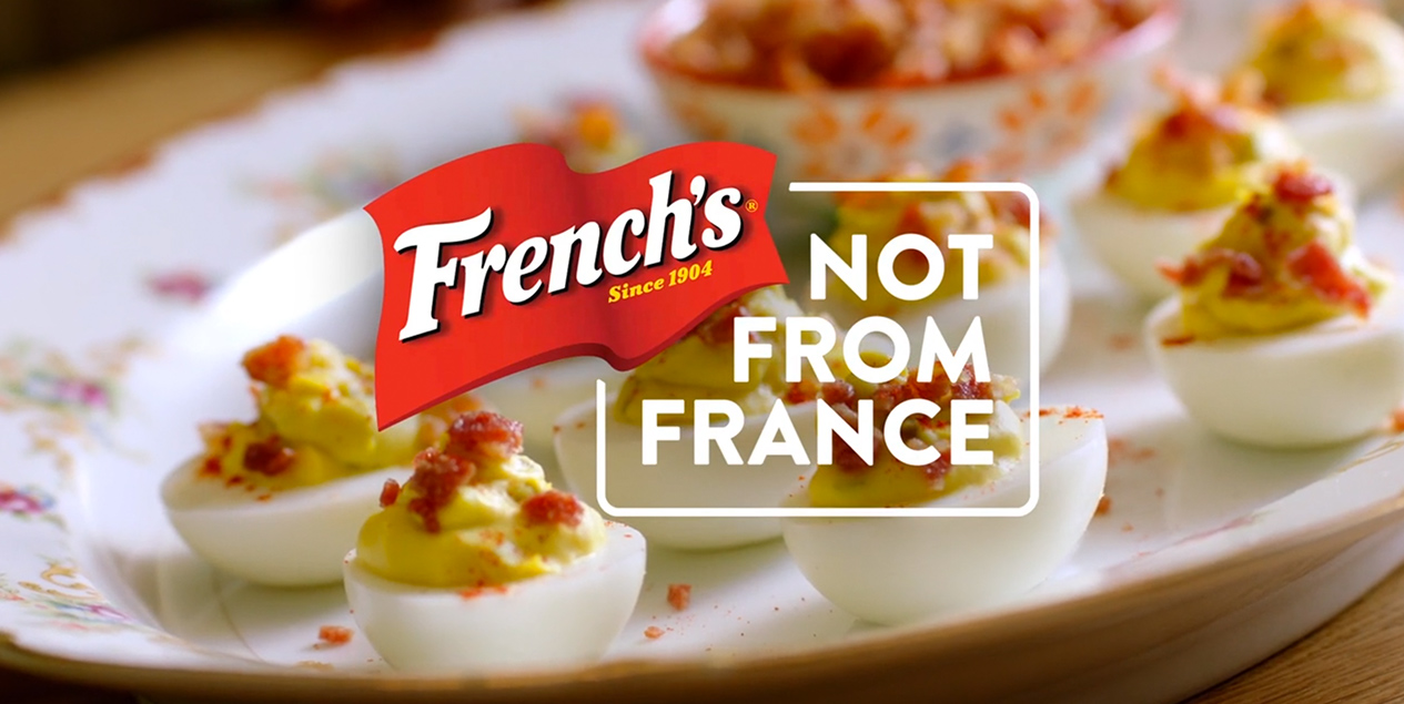Deviled eggs behind French's logo