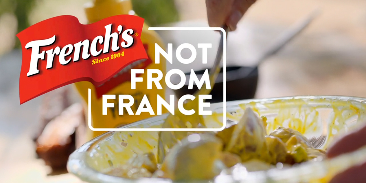 Potato salad behind French's logo