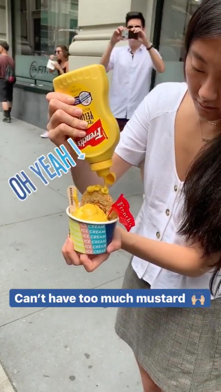 Woman putting French's Mustard on French's Mustard IIce Cream